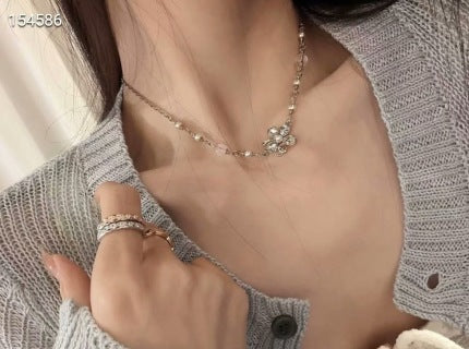 Chanel Elegant Pearl Bow Charm Necklace