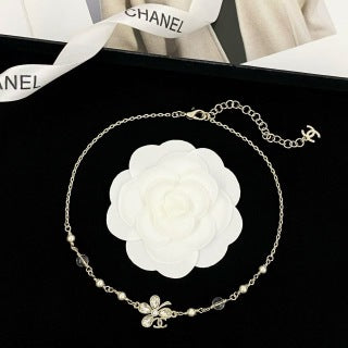 Chanel Elegant Pearl Bow Charm Necklace