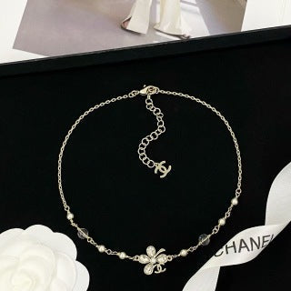 Chanel Elegant Pearl Bow Charm Necklace