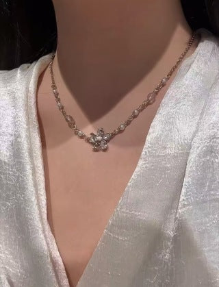 Chanel Elegant Pearl Bow Charm Necklace