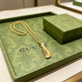 Gucci GG Ribbed Drop Pendant Gold Chain Necklace