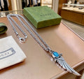 Gucci Blue Stone Winged Spike Pendant Silver Necklace