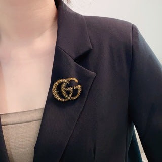 Gucci GG Interlocking Textured Gold Brooch
