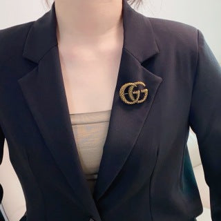 Gucci GG Interlocking Textured Gold Brooch