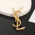YSL Sculpted Gold Monogram Brooch
