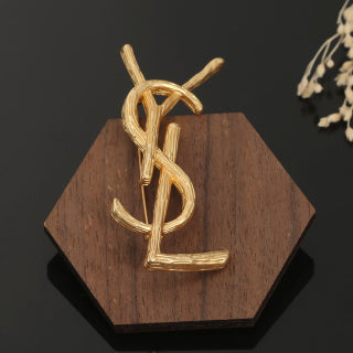 YSL Sculpted Gold Monogram Brooch