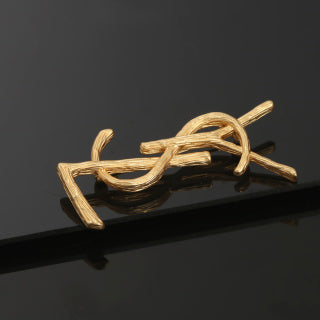 YSL Sculpted Gold Monogram Brooch